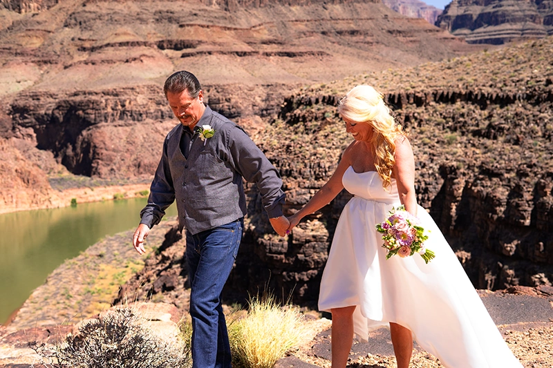 Couple posing for wedding photos at the Grand Canyon