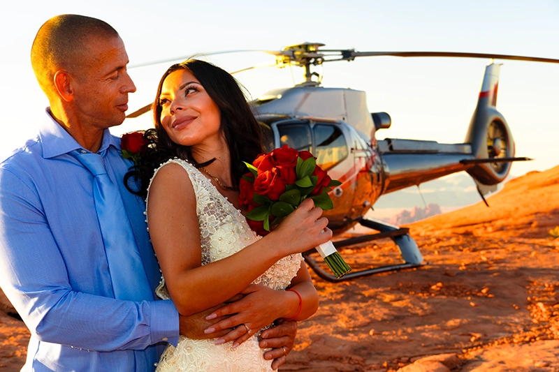 Couple on a red rock peak during Valley of Fire helicopter wedding
